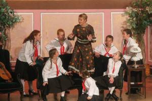 Cast members of "The Sound of Music," presented by Ricks-Weil Theatre Company in downtown Greenfield, engage in a singing lesson while testing the sturdiness of Austrian furniture. -- Photo provided