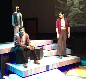 Elloit (Mauricio Miranda, front, left) and his cousin Yazmin (Elysia Rohn, right) deal with the death of the woman who raised them, among other issues, while the ghost of an Iraqi Elliot killed (Sunny Arwal) haunts in the background in a scene from "Water By The Spoonful," presented by Wisdom Tooth Theatre Project at the IndyFringe Theatre in downtown Indianapolis. -- Wisdom Tooth photo